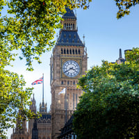 Phot of Elizabeth Tower and UK flag in the background on Houses of Parliament