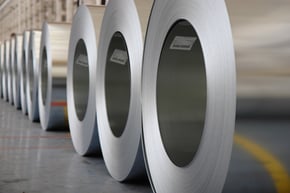 The image shows rolls of steel