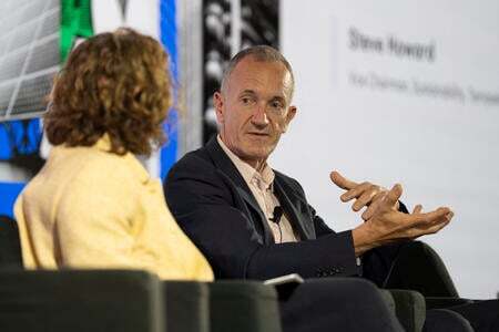 Steve Howard speaking to Helen Clarkson on stage