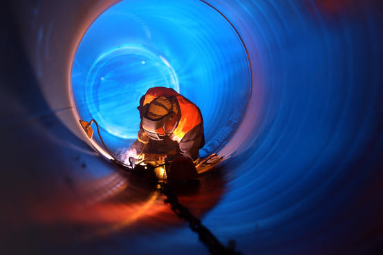 worker in a large tube