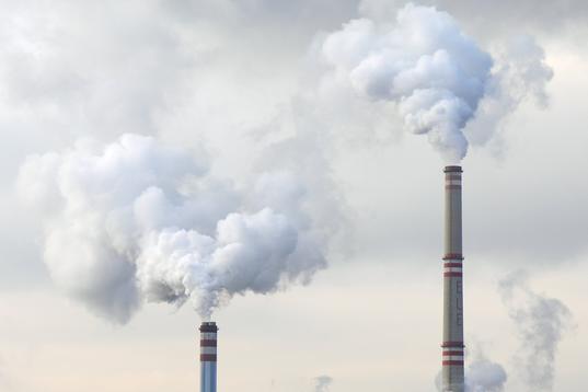 Industrial chimneys emitting smoke
