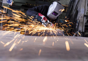 Man cutting steel creating sparks