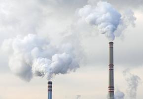 Industrial chimneys emitting smoke