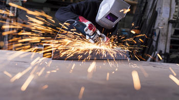 Man cutting steel creating sparks
